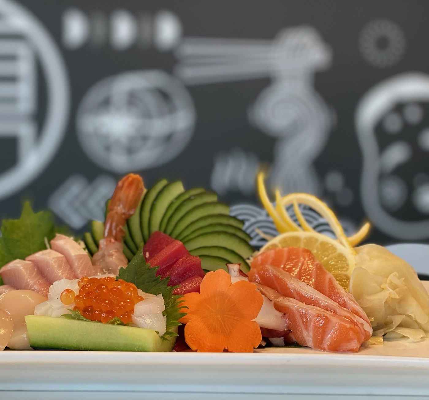 Sashimi arranged on a white plate