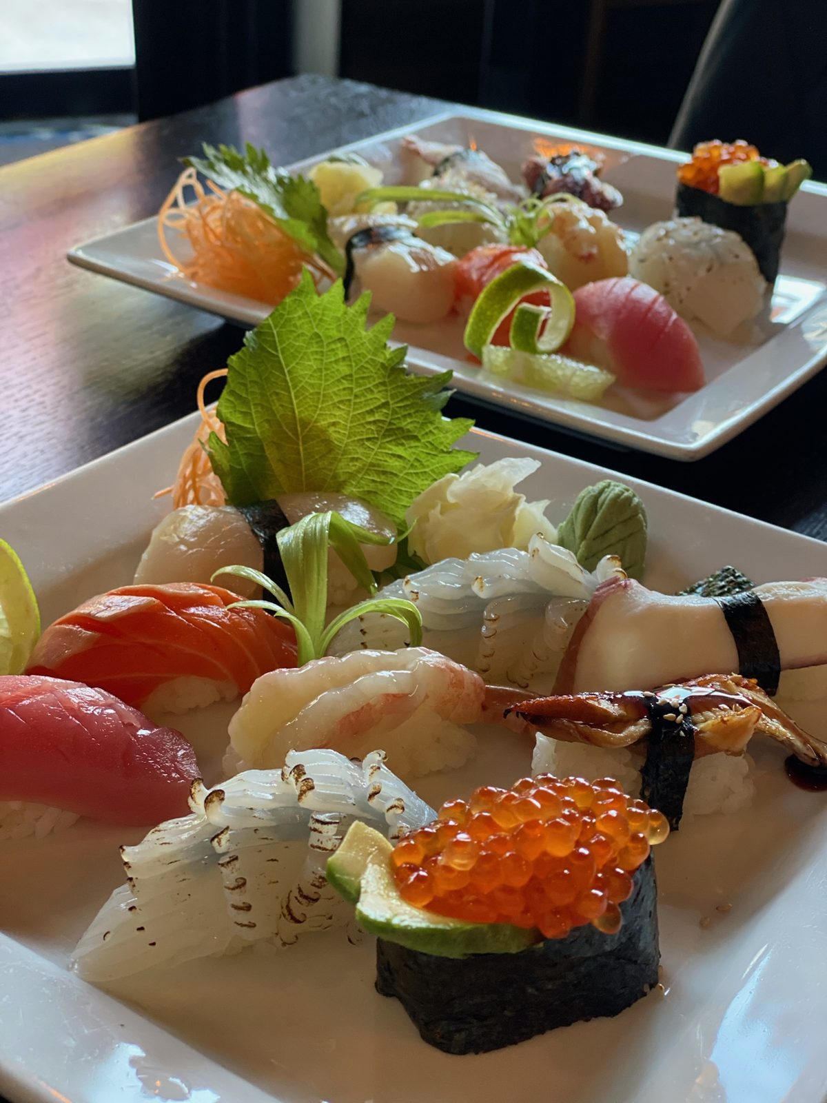 Nigiri sushi on a white plate